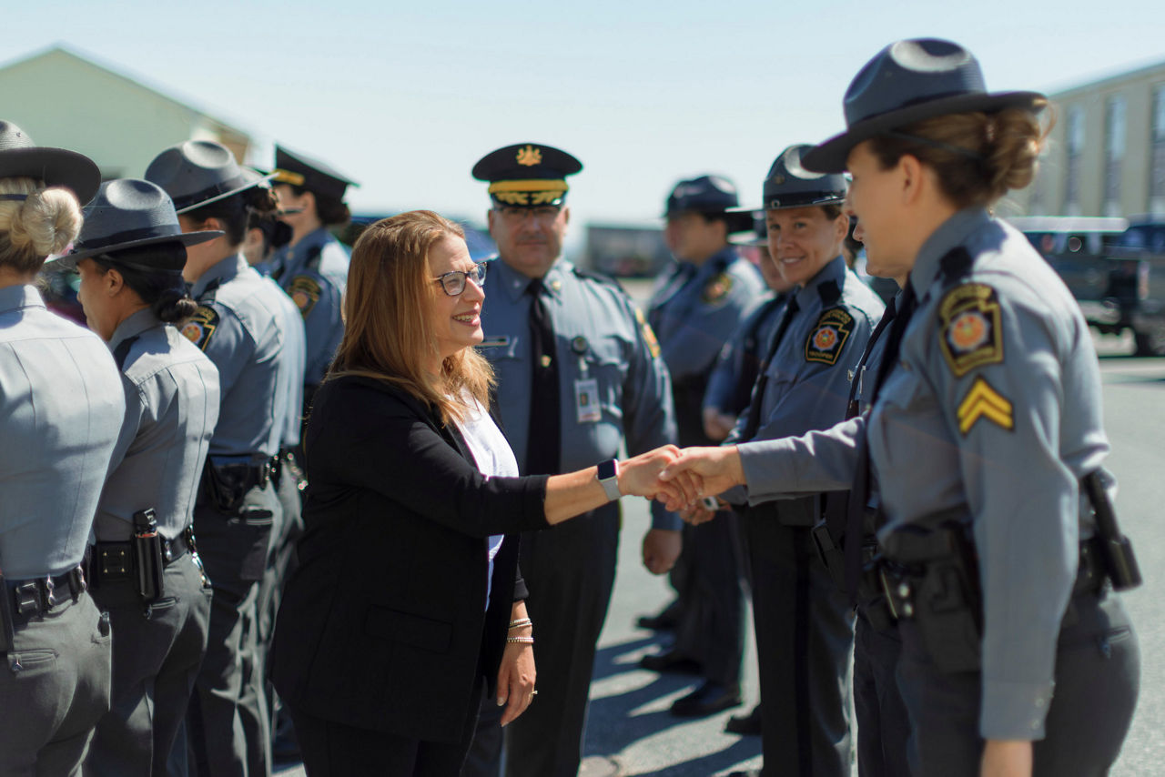 First Lady Lori Shapiro shaking hands with a police officer. 