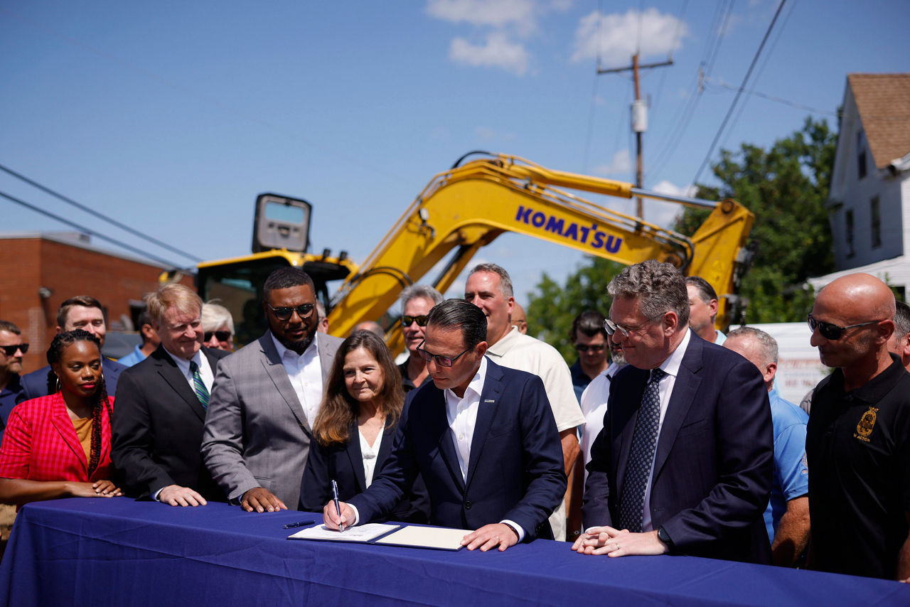 Governor Josh Shapiro signing a bill. 