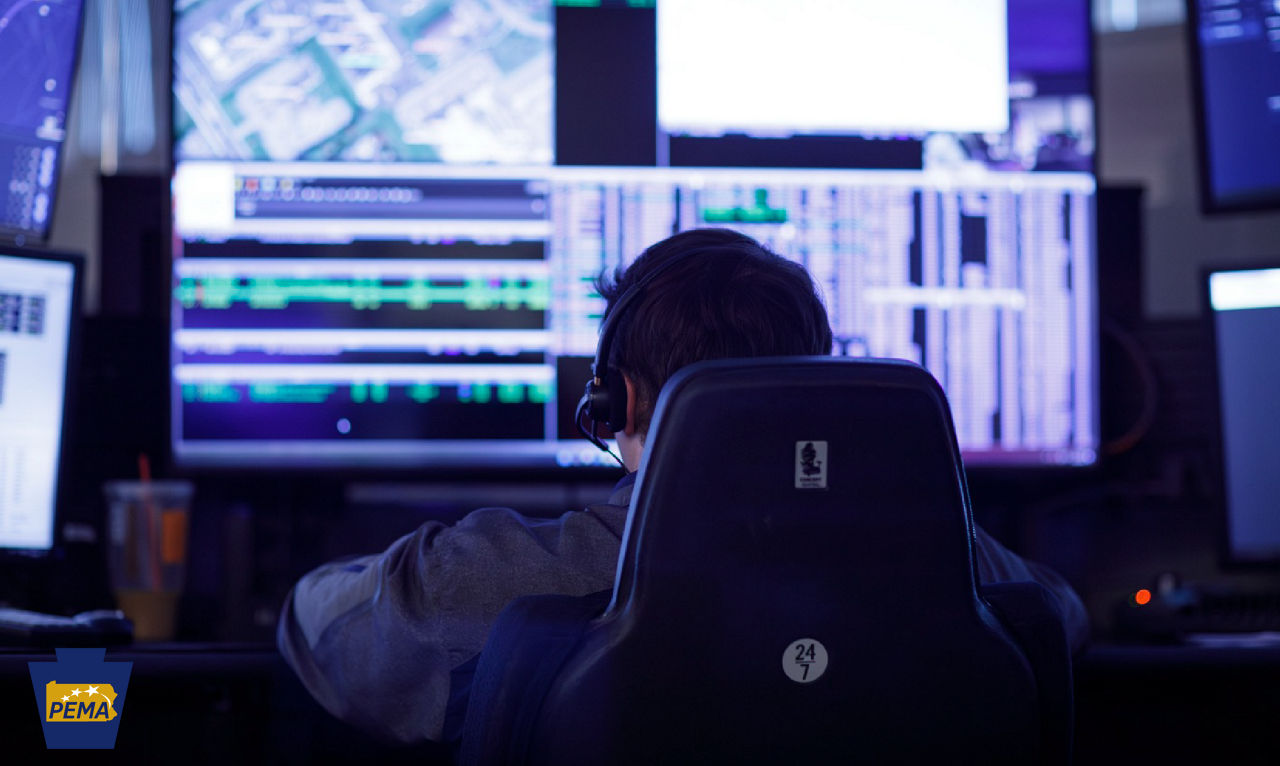 County 911 dispatcher at his workstation.