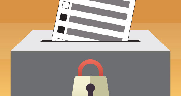 Ballot being placed inside of a ballot box with a lock