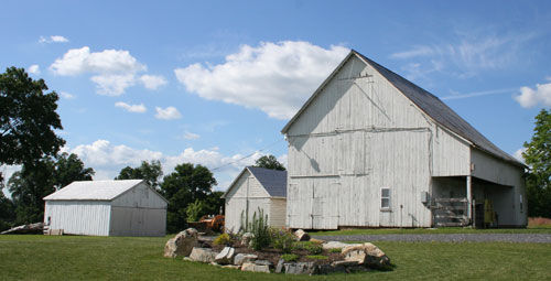 Gable view of two-story frame barn.