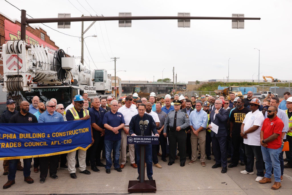 Governor Shapiro speaking at a podium in front of a crowd. 