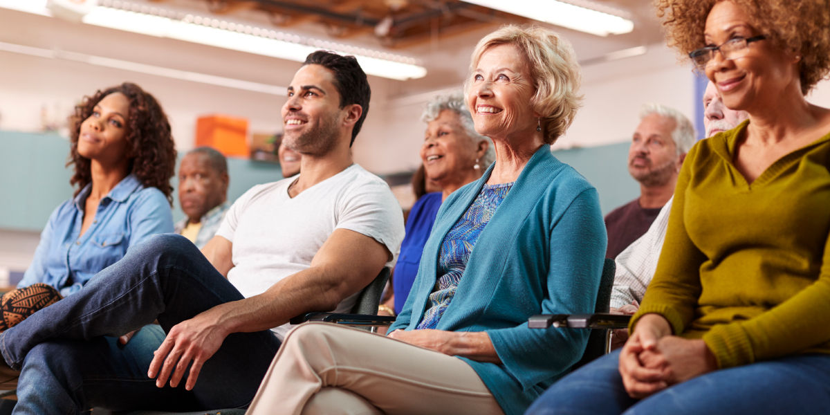 People sitting in chairs smiling