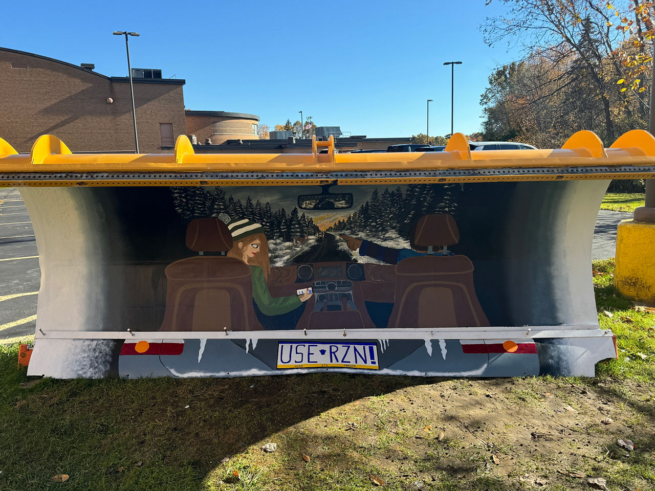 A plow painted by students at Mercer High School that depicts a distracted driver using their cell phone while the passenger points out deer ahead on the rodaway. 