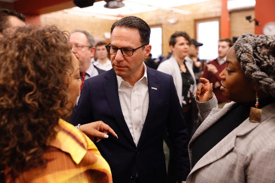 Governor Shapiro talking to two women 