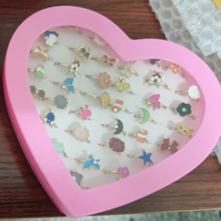 picture of pink heart case with recalled rings inside