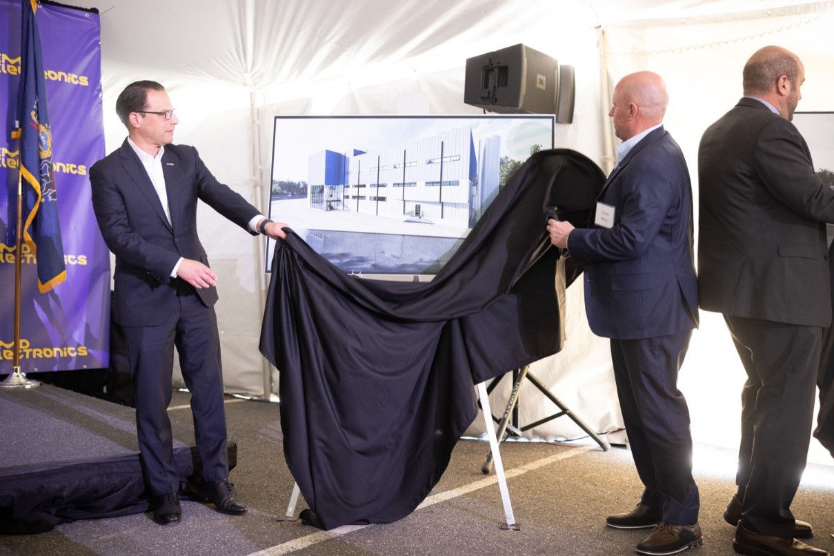 Governor Shapiro unveiling image of a building with another man 