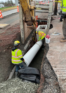 Men Performing Ridge Pike Drainage Installation