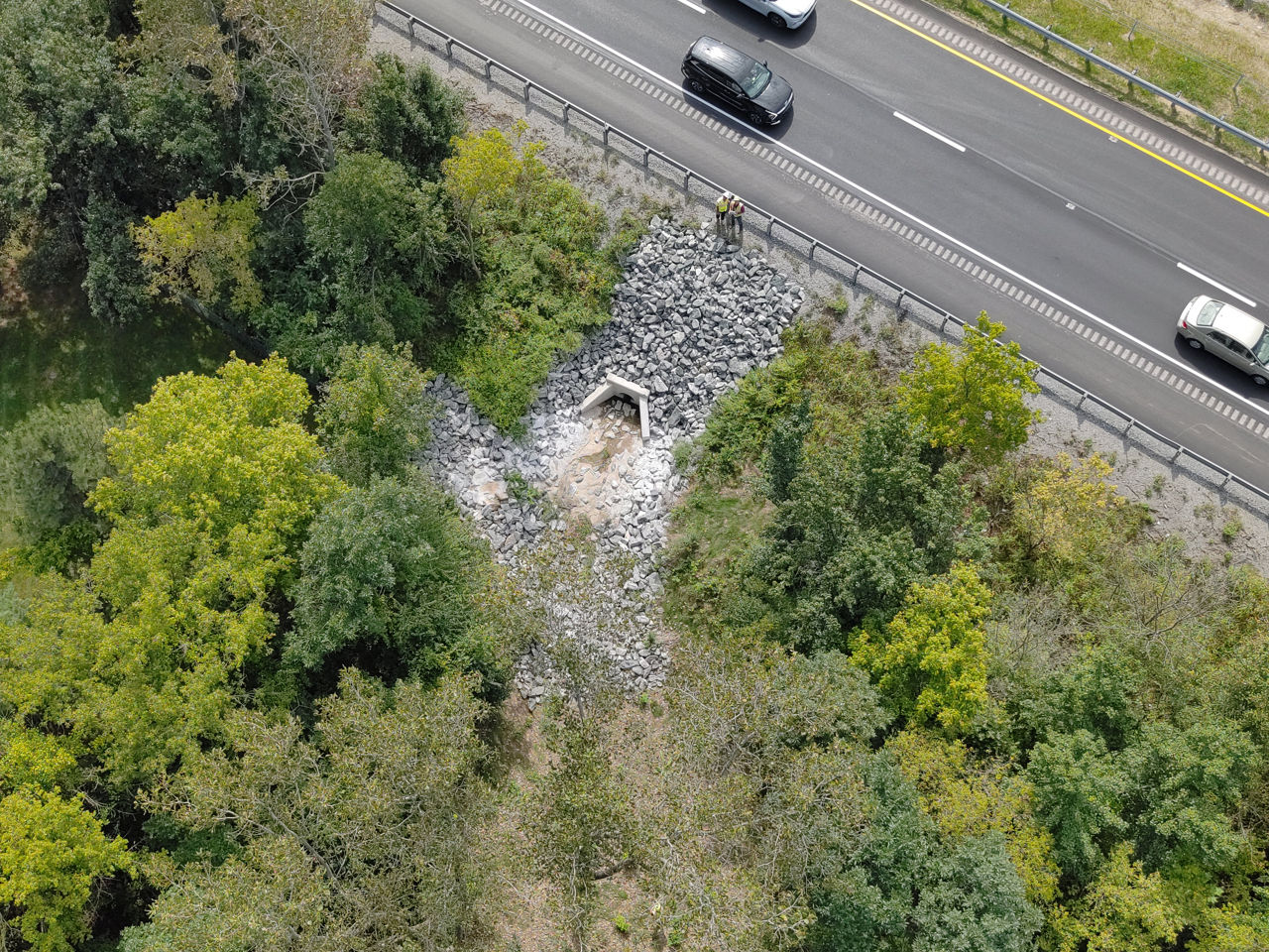 Side view of U.S. 30. Shows drainage outlet.