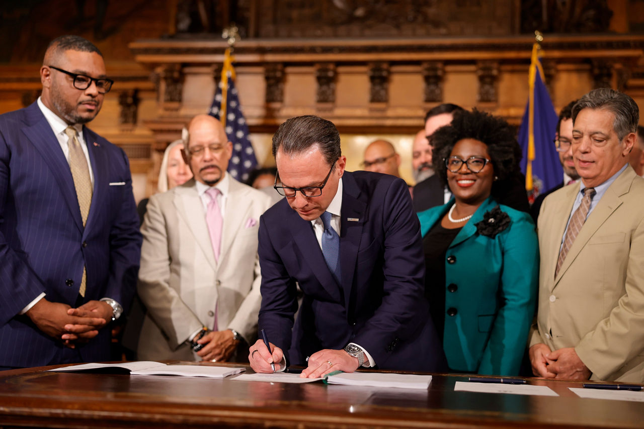 Governor Josh Shapiro signing the budget into law