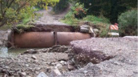 Clogged pipe inlet led to a complete road washout