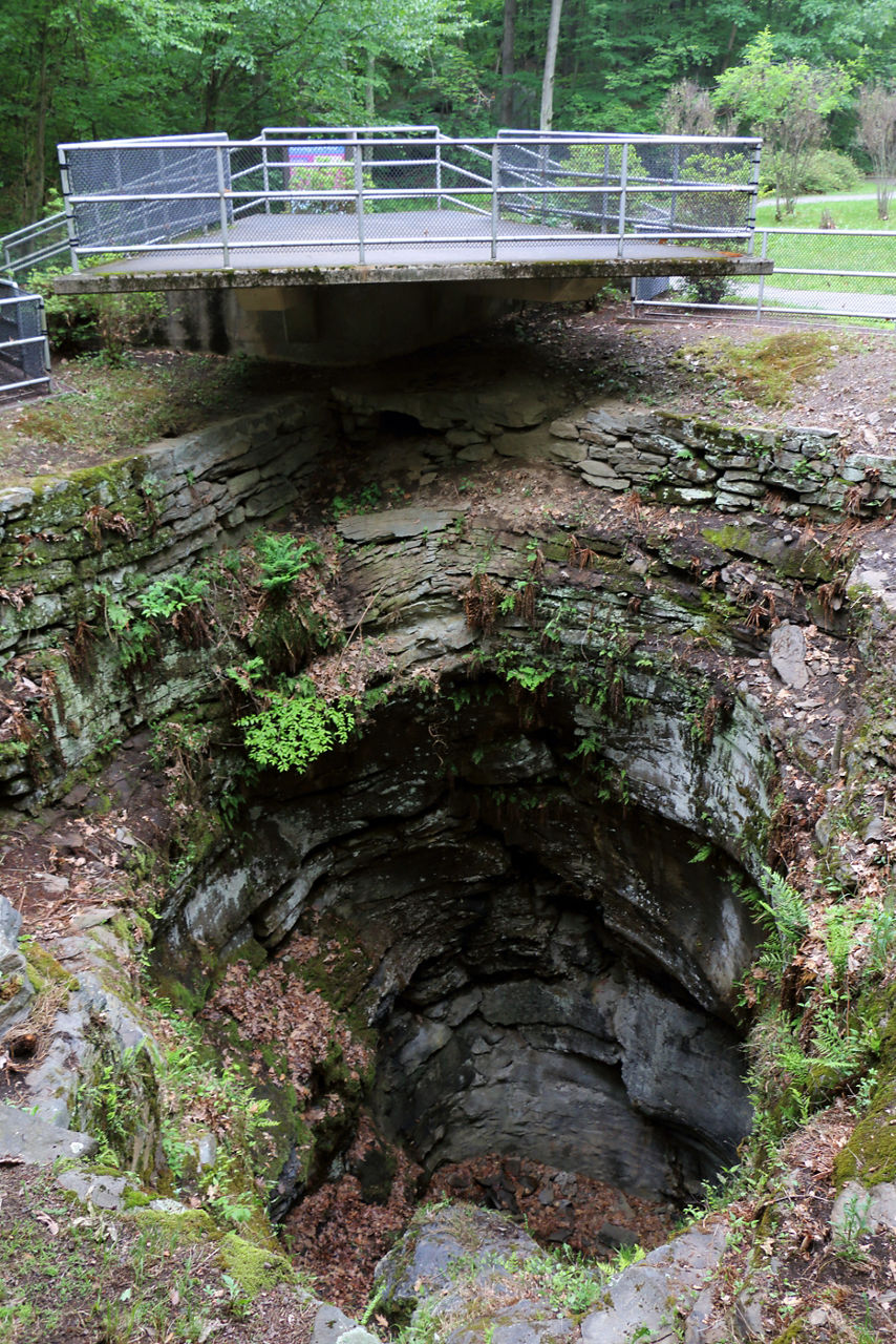 A large pothole with a viewing platform above it