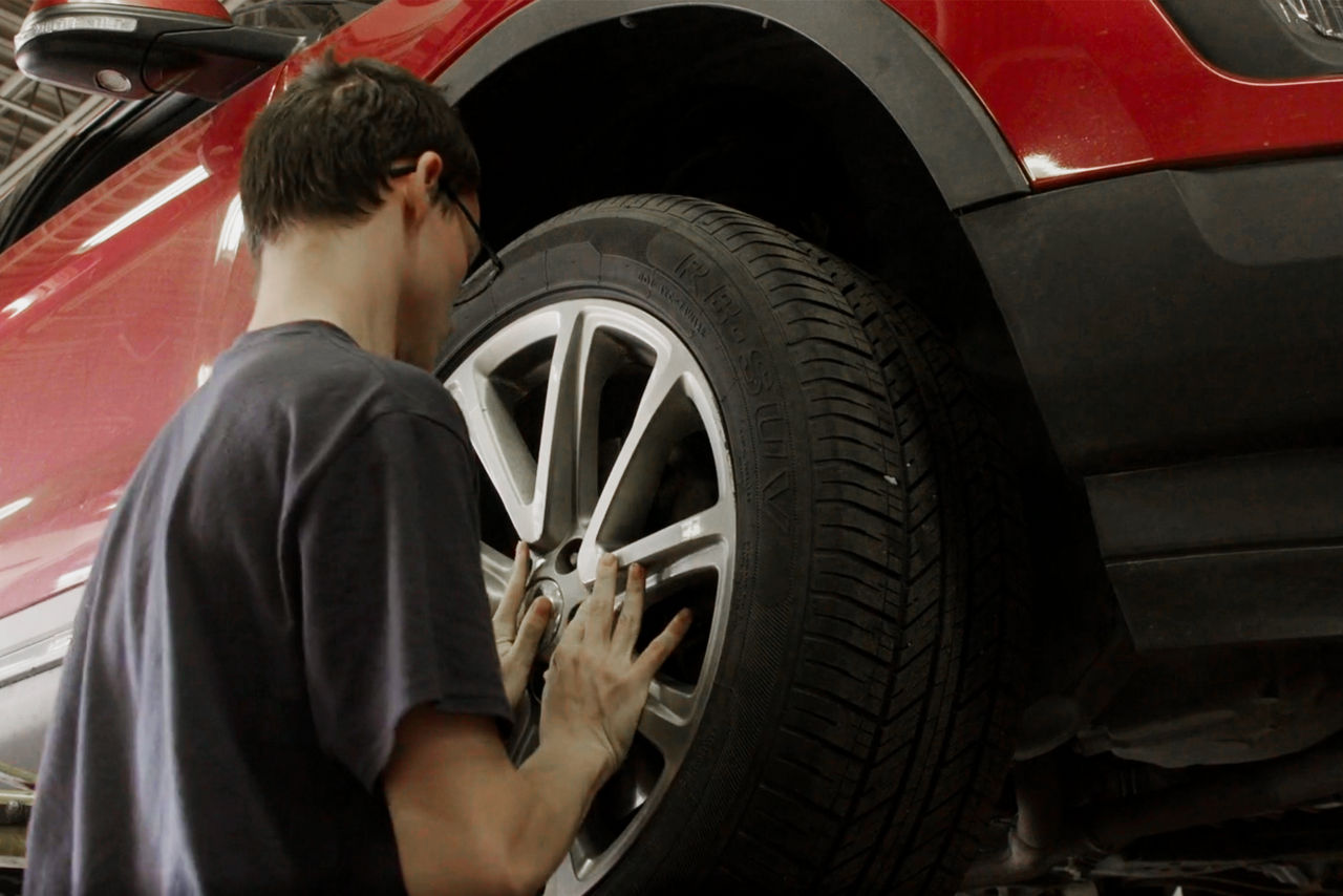 CTI at HGAC student works on a tire