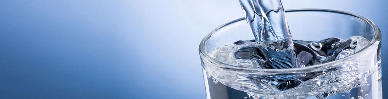 Picture of water being poured into a glass