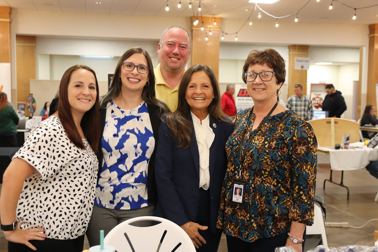 Craig Schield poses for a picture with OVR staff and L&I Secretary Nancy A. Walker