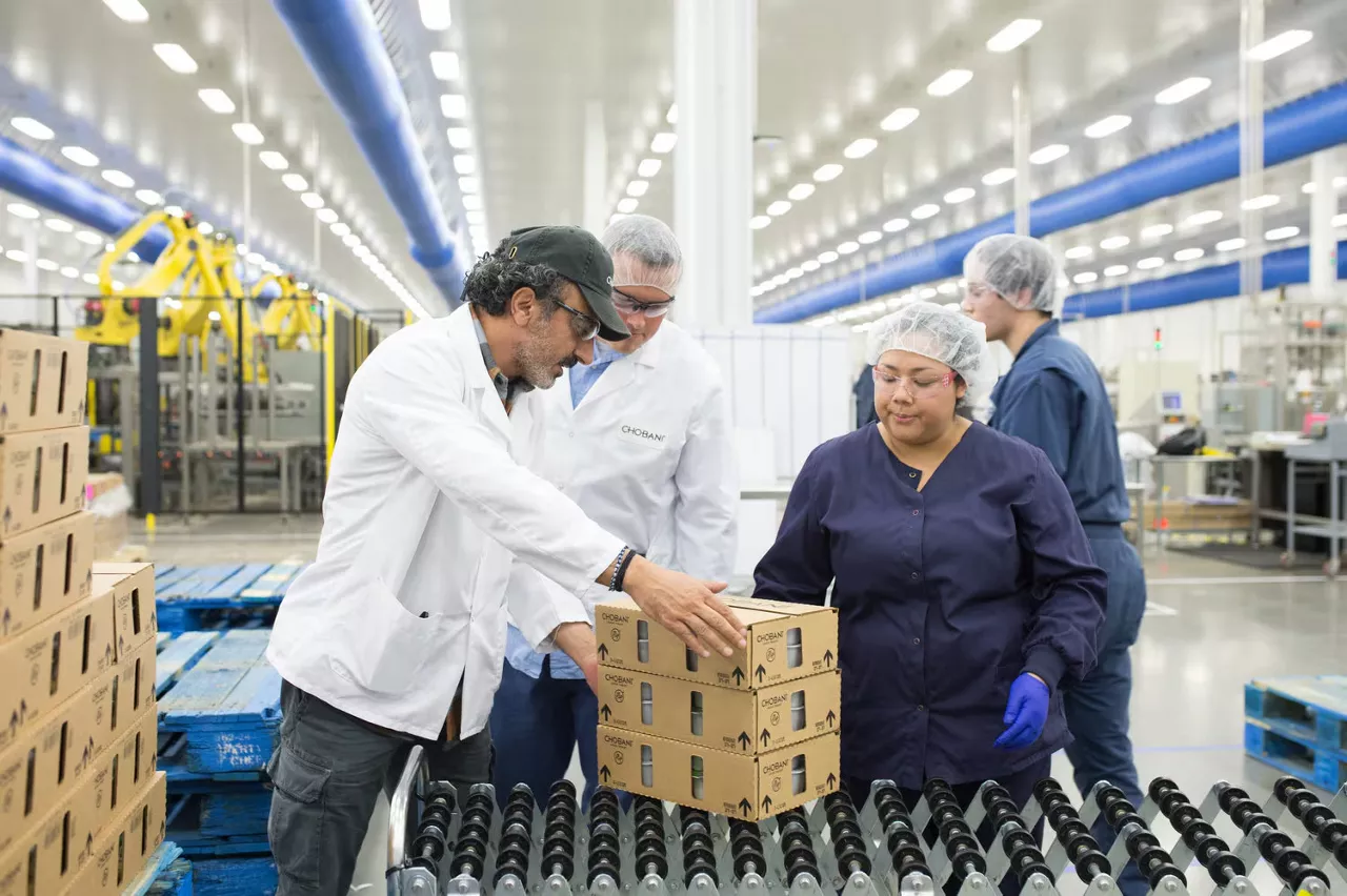 Chobani's CEO inspects boxes and interacts with employees on the factory floor.