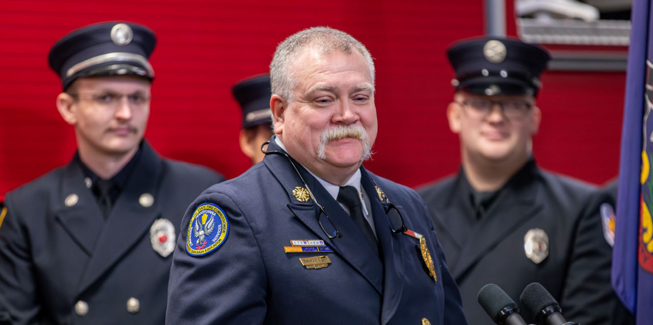 Fire Commissioner Tom Cook speaks at an event.