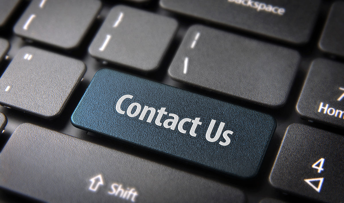 Closeup of a laptop keyboard with a Contact Us Enter key