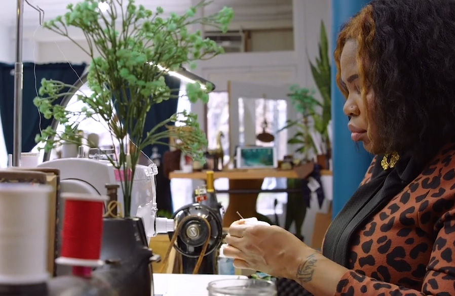 Creative small business owner sewing