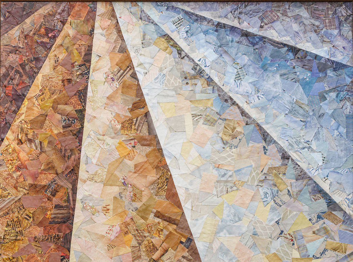 colored torn paper in shades from brown to blue