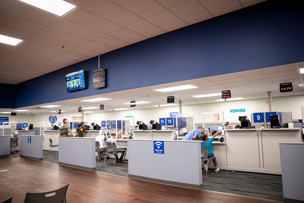 People waiting at a counter