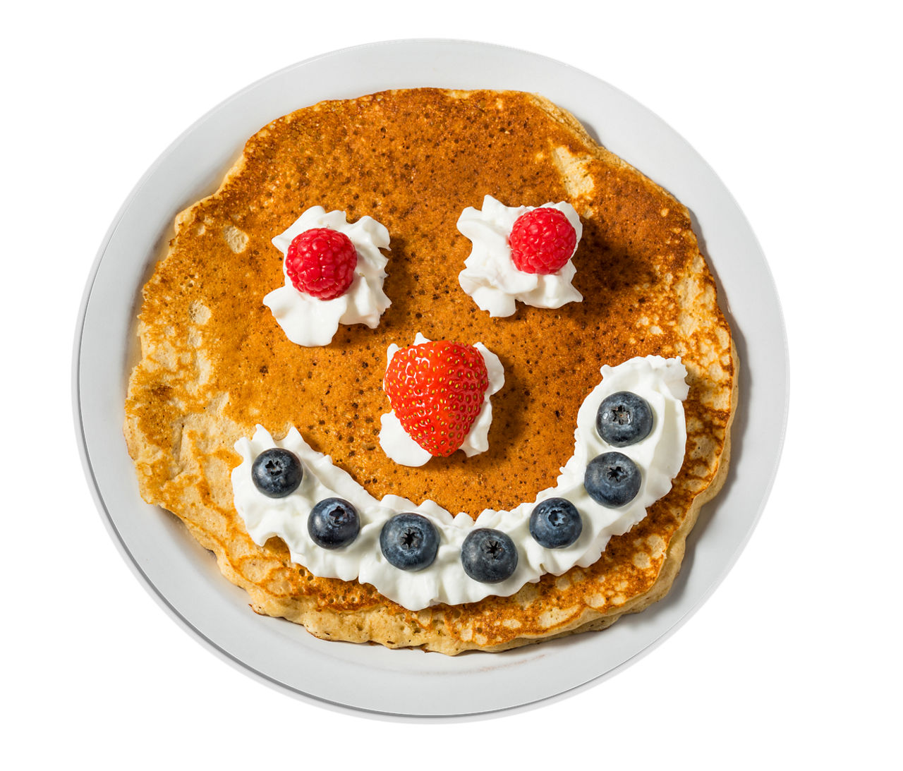 Pancake with face made out of berries
