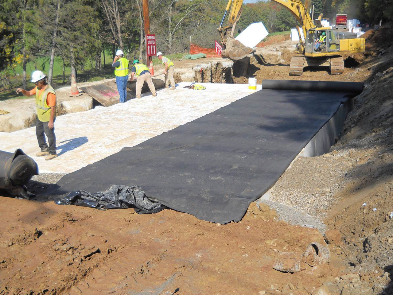 construction crew placing top layer on geofoam.