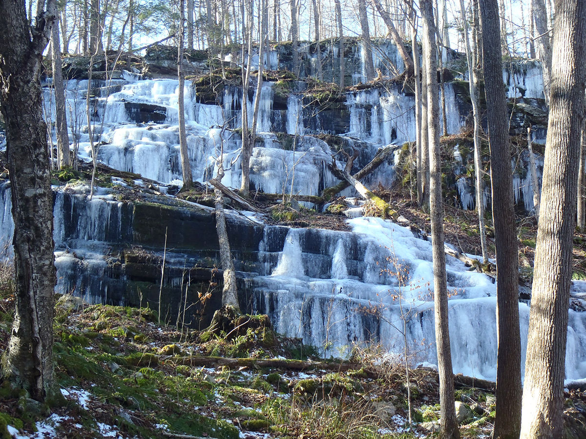 Water rushes down a waterfall at the Stairway Wild Area in Delaware State Forest.