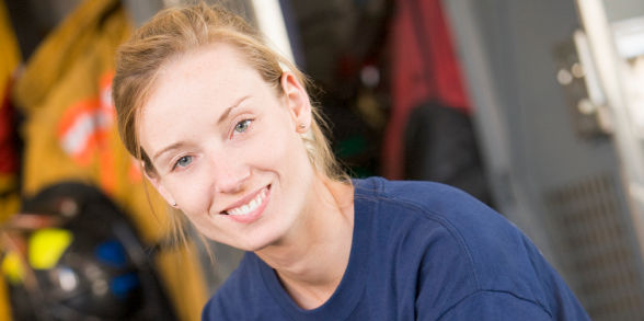 A firefighter smiles for a photo