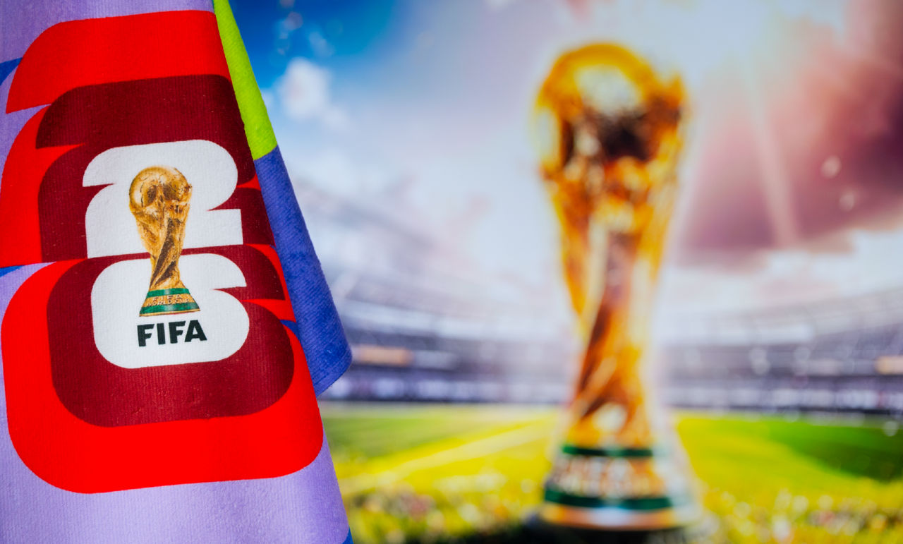 FIFA trophy in the background with the 2026 FIFA logo in the foreground.
