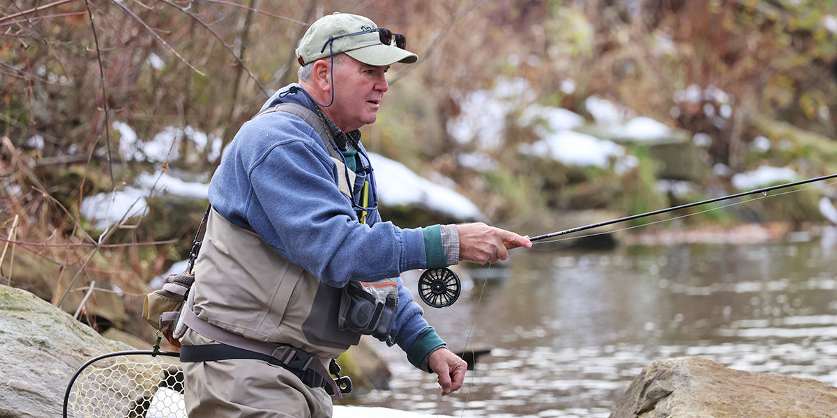 Fly fishing angler, Tony Sobina, casts his fly rod out to Sugar Creek in Bradford County, PA.