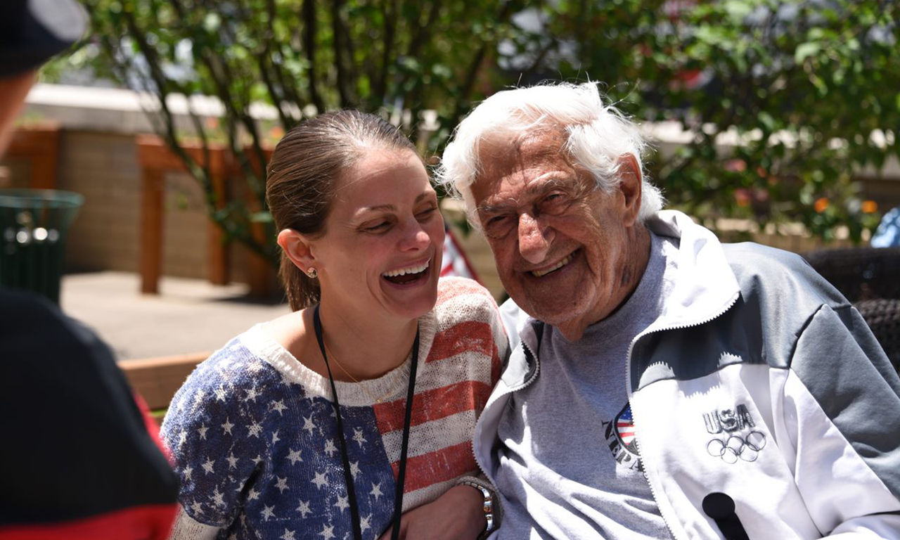 Woman and man laughing together