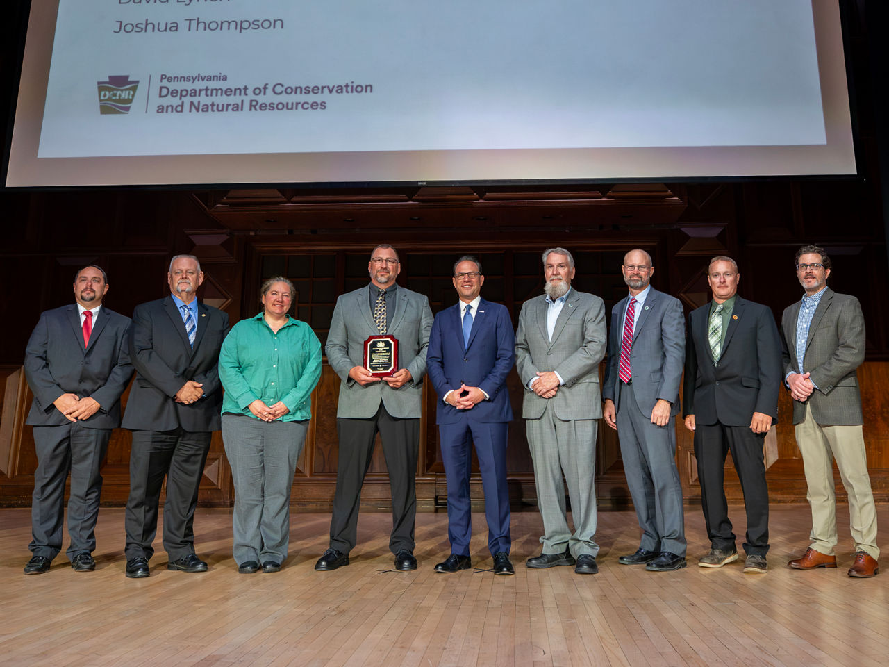 The Michaux State Forest Wildfire Response Team poses for a photo with Governor Josh Shapiro while receiving a Governor's Award for Excellence.