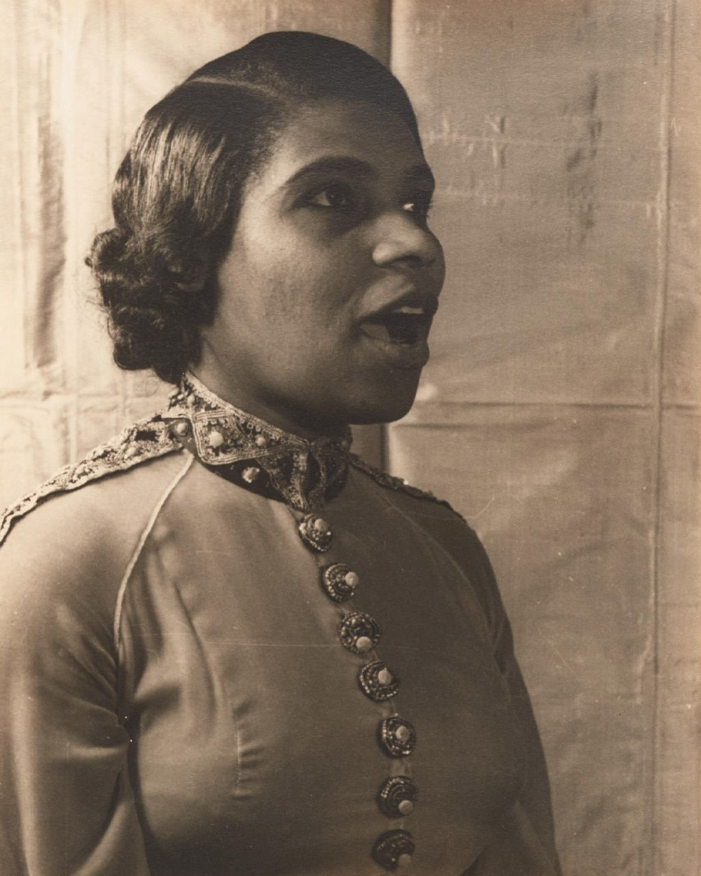 Vintage portrait of woman in ornate uniform