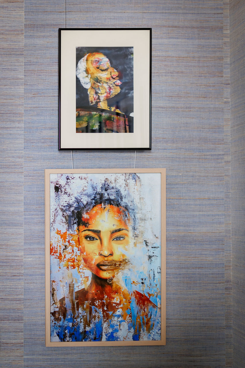 Abstract portrait and colorful modern painting on wall