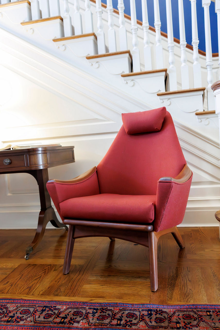 Red modern armchair in elegant home interior