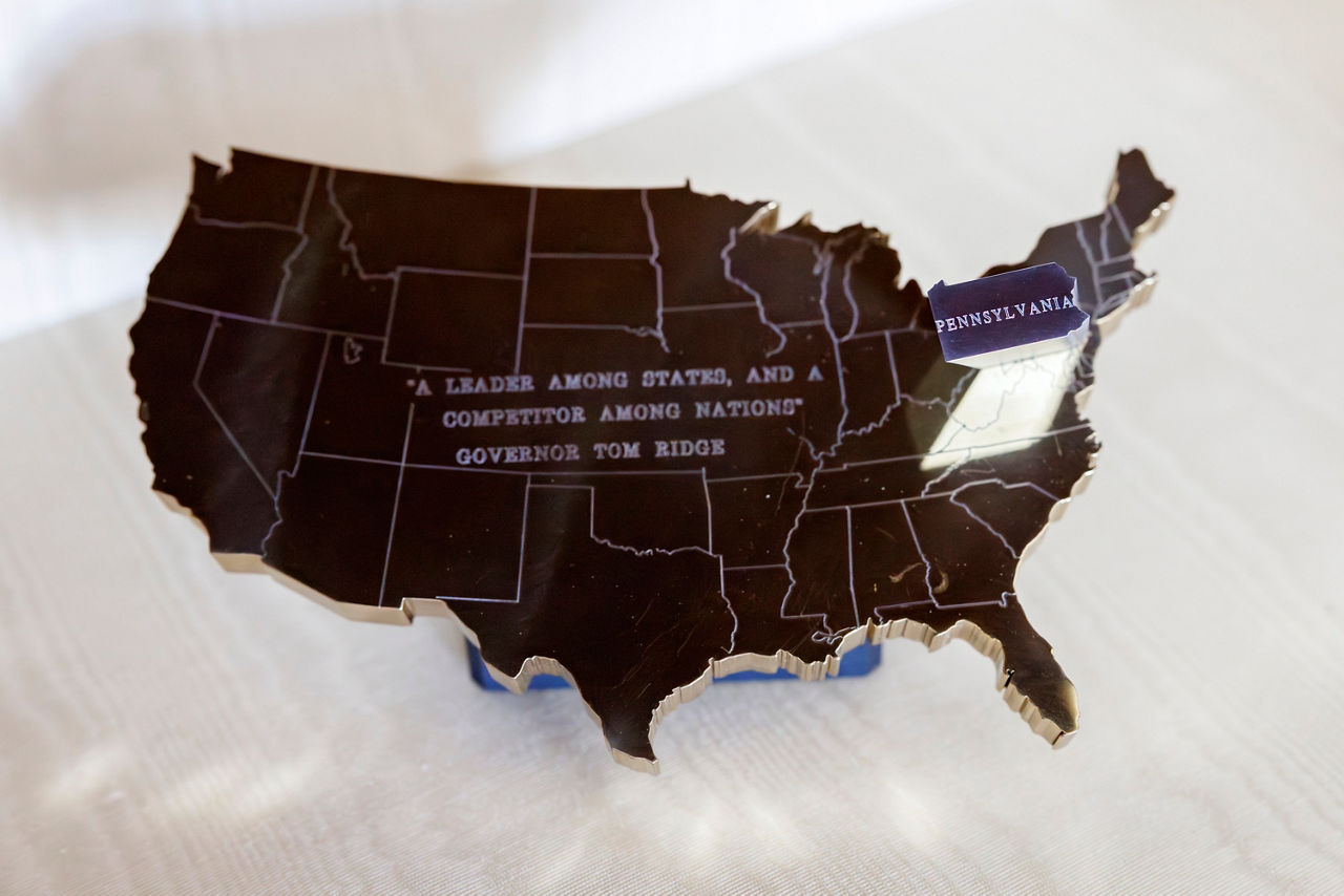 Silhouette of the USA with a quote by Governor Tom Ridge, highlighting Pennsylvania. 