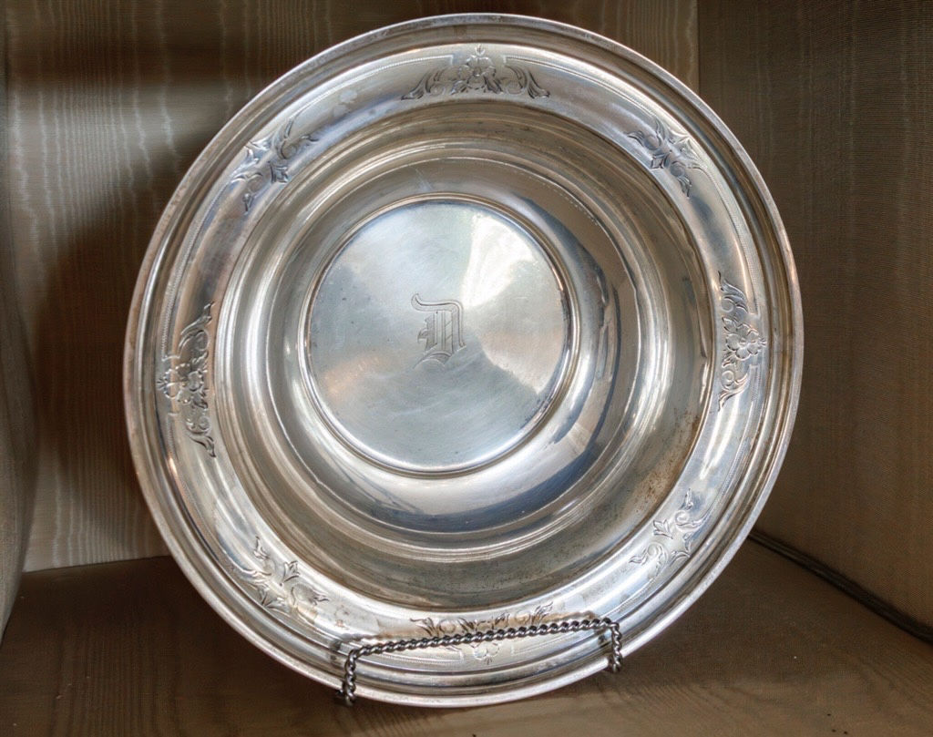 Silver bowl with a monogram.