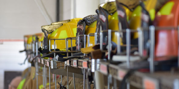 Image of a line of firefighter helmets