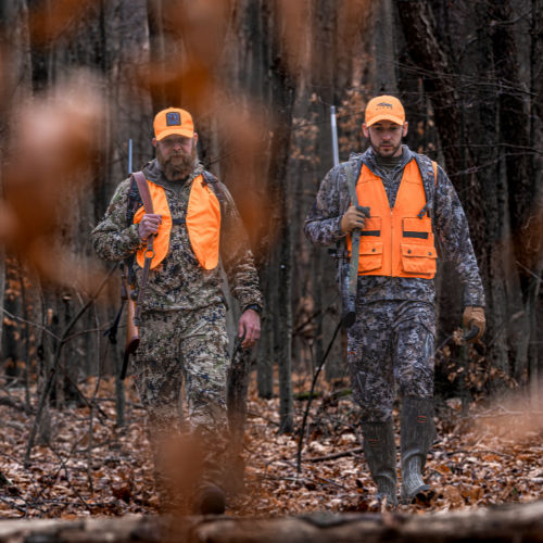 hunters in orange walking