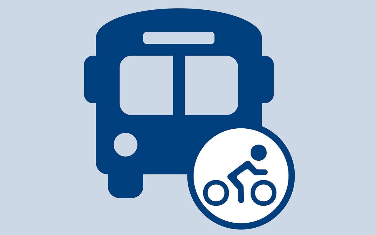 bus and person on a bike