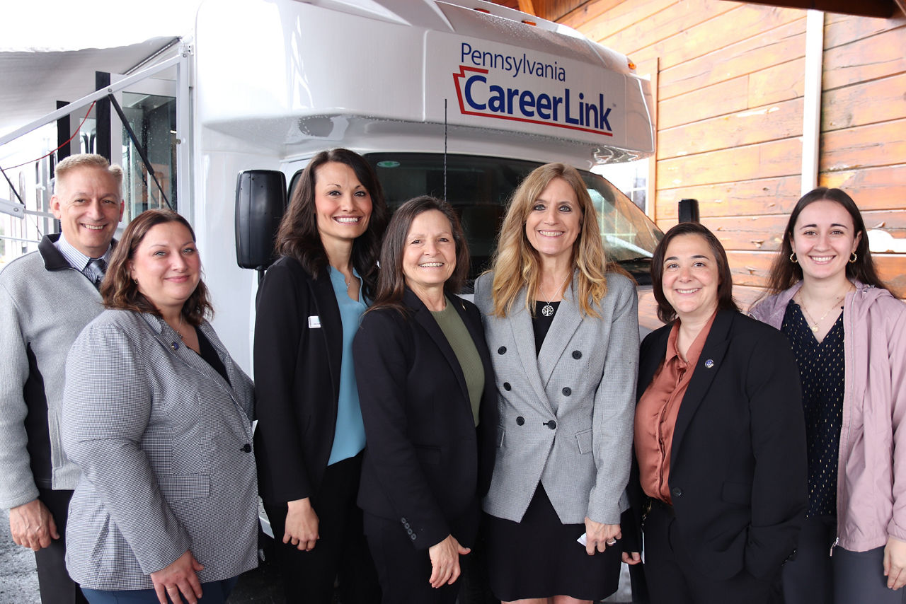 L and I Secretary Nancy A. Walker stands with other Labor and Industry and Career Link employees in front of the newest mobile PA CareerLink® unit – the third of its kind in Pennsylvania.