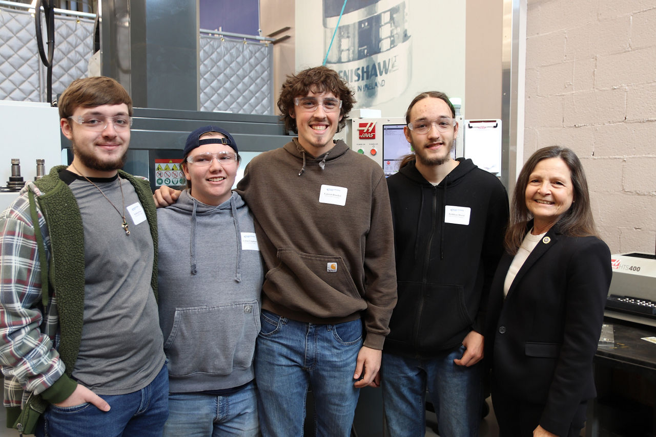 L and I Secretary Nancy A. Walker stands with students from Pitt-Titusville's Machining Program 