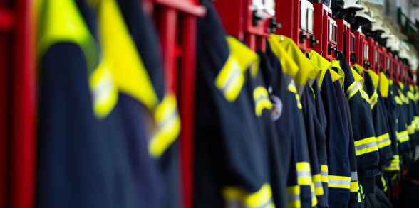 Firefighting gear hanging on lockers