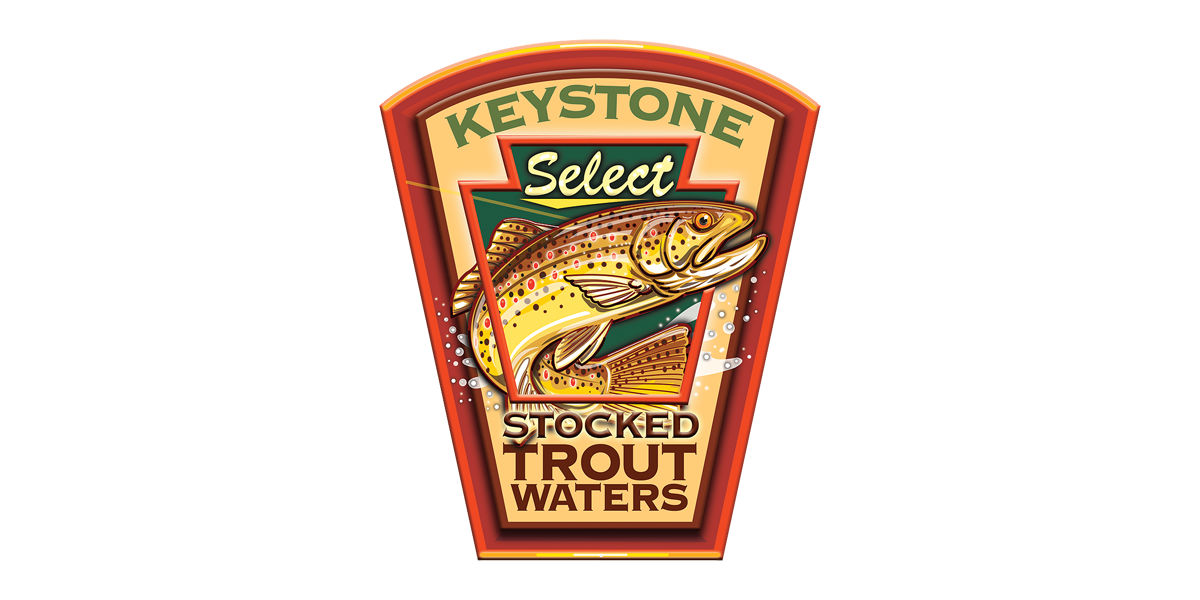 Keystone with a brown trout showcasing the Keystone Stocked Trout Waters logo