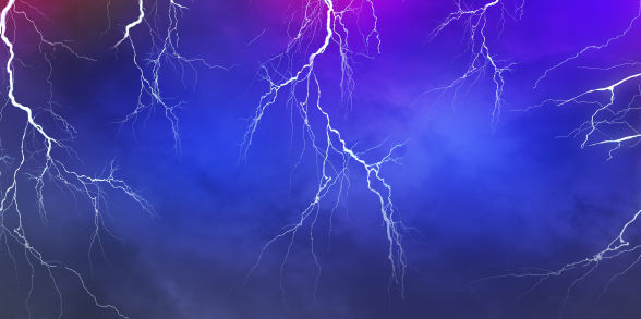 Lightning flashes across a purple and blue sky.