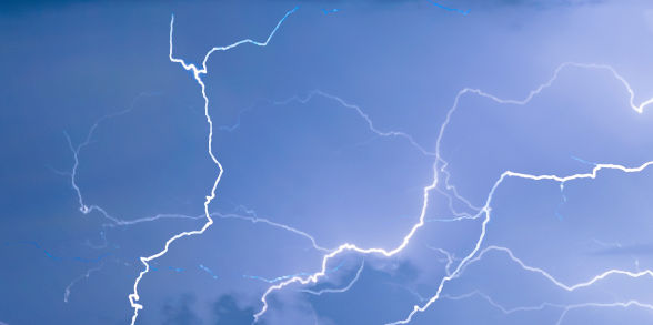 Lightning lights up a stormy sky.