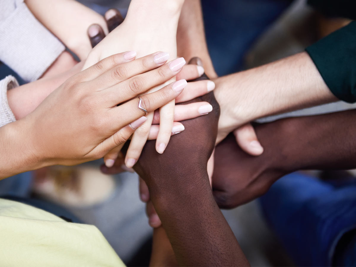 Diverse hands joined in unity