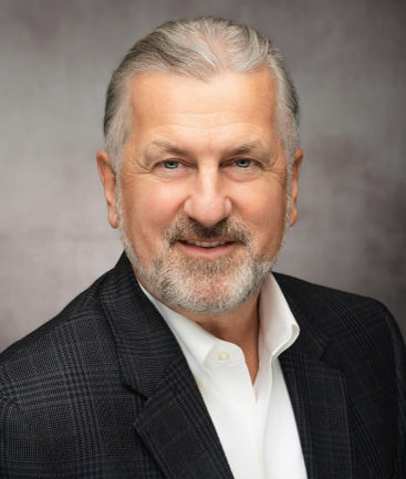 headshot of Mark B. Woodland, MS, MD 