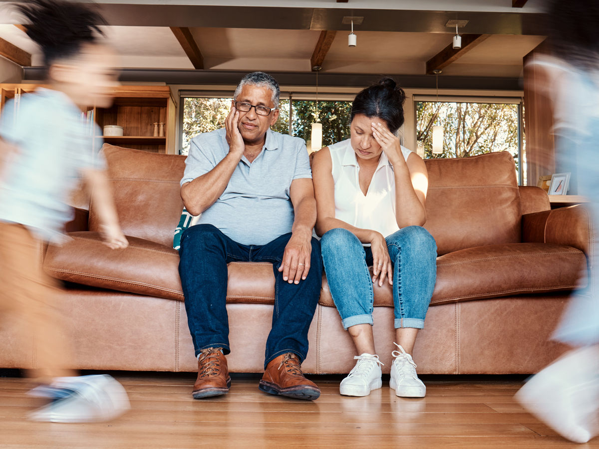 overwhelmed couples with children running